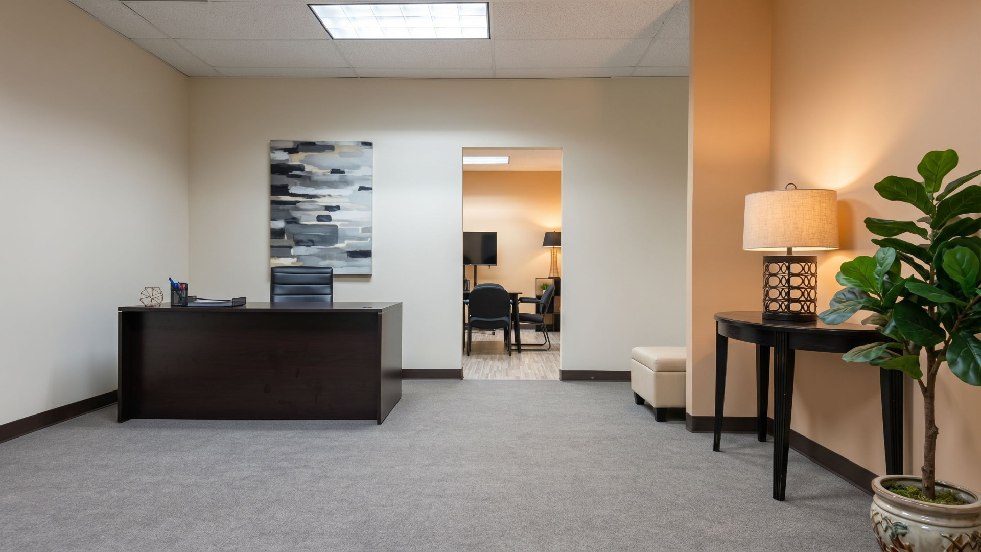 Suite 350 reception area with a front desk and waiting seating